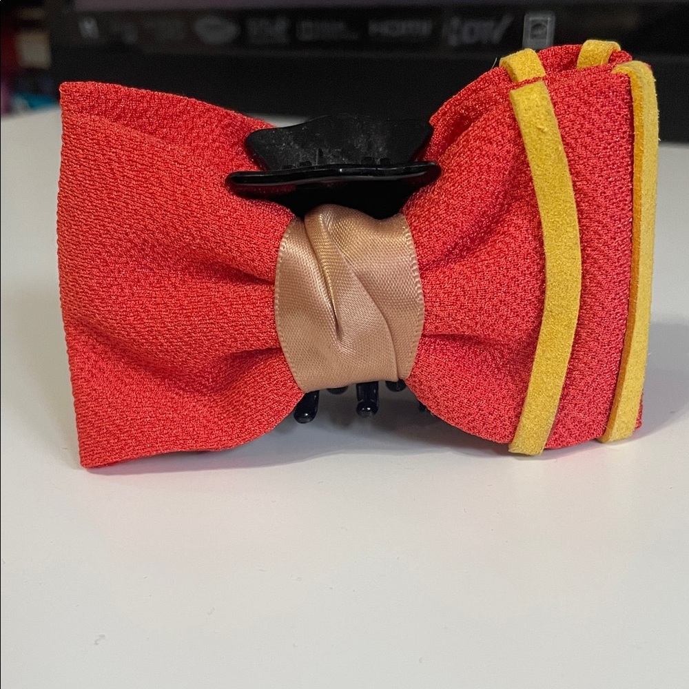 Orange-red and yellow bow hair claw